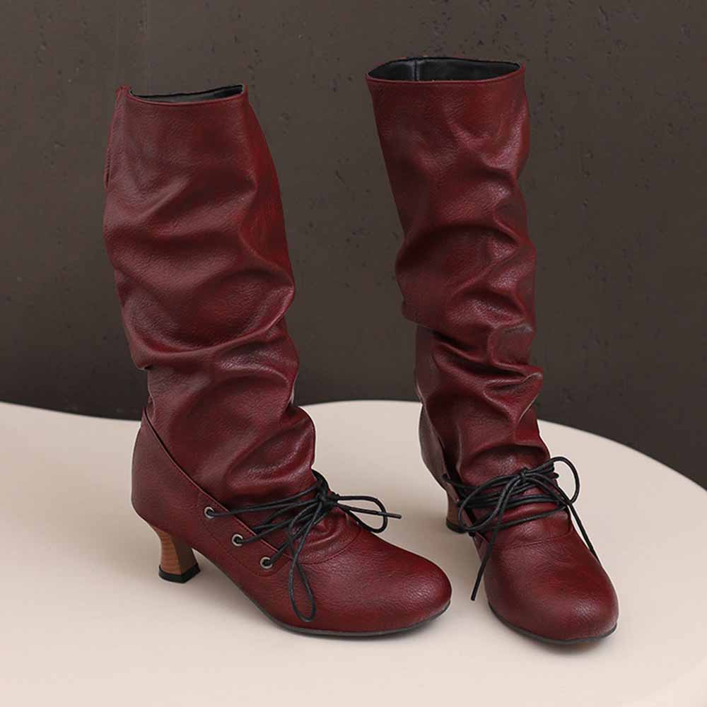 Stylish burgundy women's lace-up high shaft boots with a slouchy design and low heel