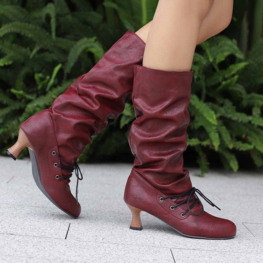Stylish women's lace-up high shaft boots in red with a unique slouchy design and chunky heels