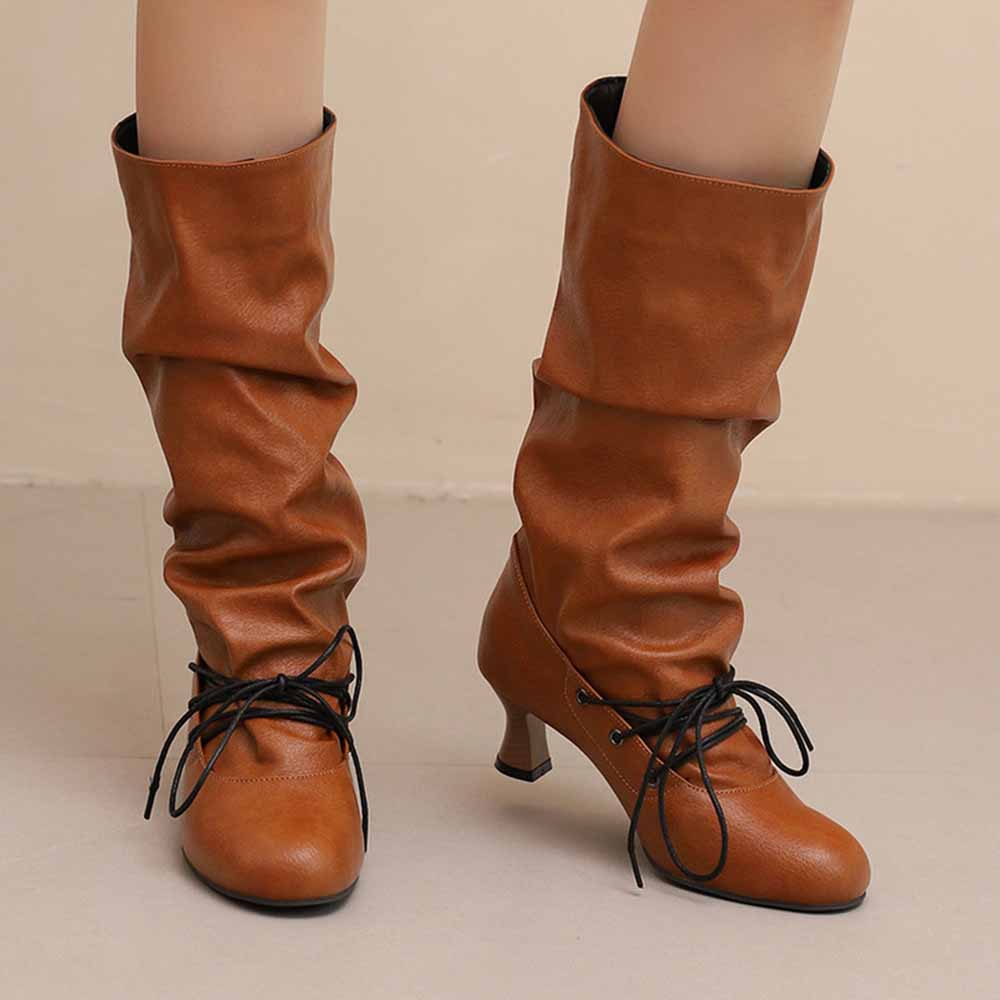Women's lace-up high shaft boots in brown with slouchy design and heeled sole for stylish comfort