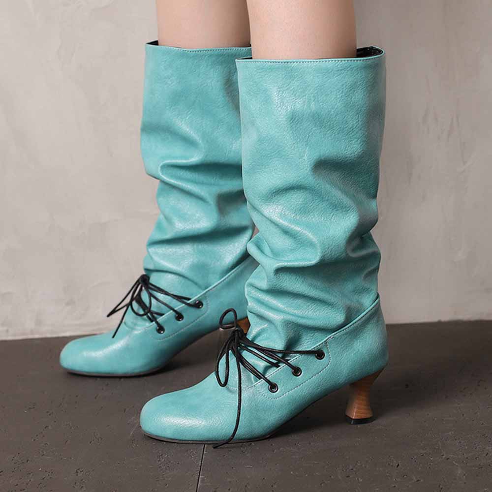 Women's lace-up high shaft boots in teal with slouchy design and low heel for a stylish look