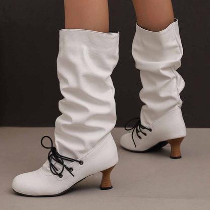 Stylish women's lace-up high shaft boots in white with a gathered design and a chunky heel