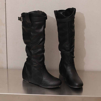 Stylish women's lace-up wedge boots in black with slouchy design and ankle strap