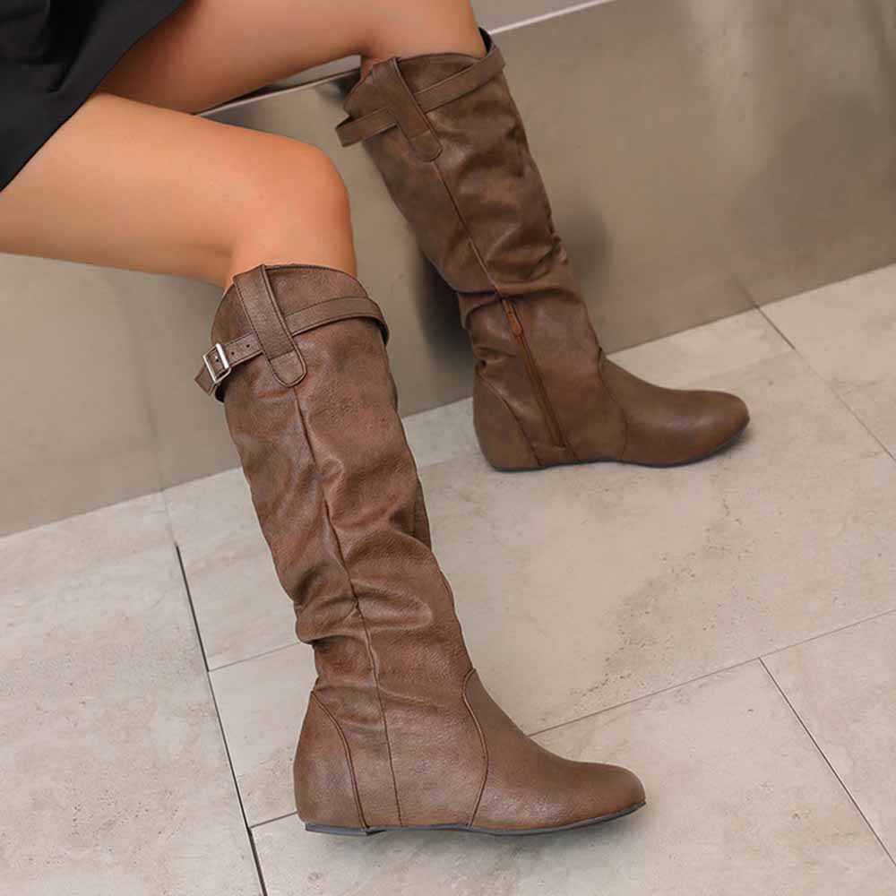Brown women's lace-up wedge boots with a stylish slouchy design and ankle buckle detail