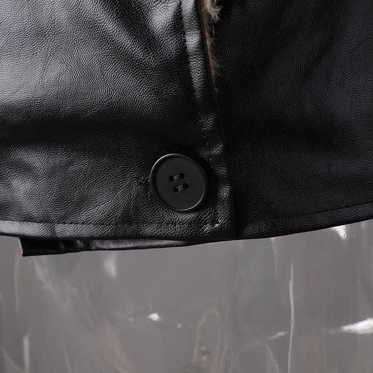 Close-up of women's leather effect jacket with shearling collar featuring stylish button detail