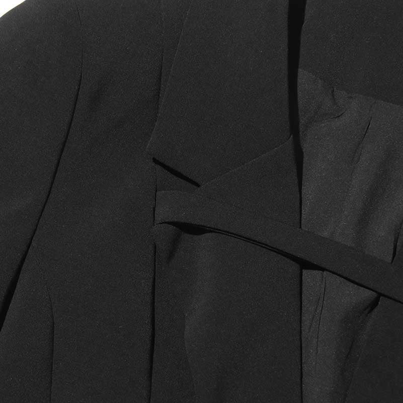 Close-up of sd-hk women's maxi blazer coat in black fabric with elegant design details