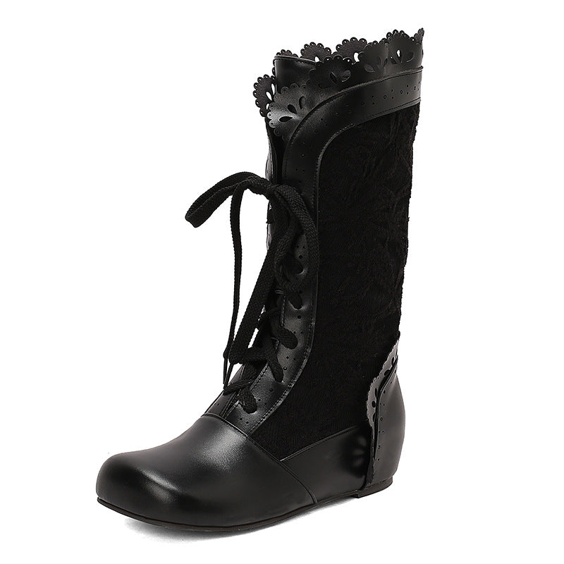 Black women's mid-calf lace up wedge boots with floral detailing and a sleek design