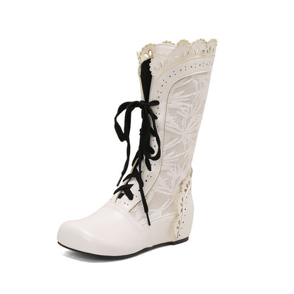 Stylish women's mid-calf lace up wedge boots in white with decorative lace and detailing