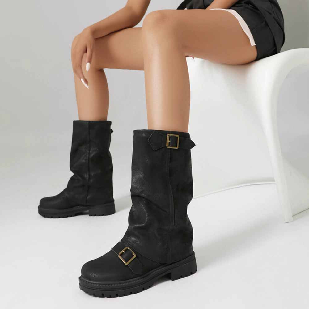 Black women's mid-calf low heel boots with buckle detail, perfect for casual styling.