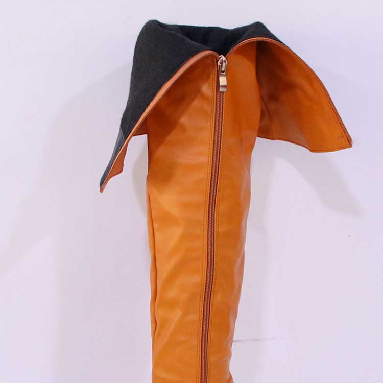 Stylish women's over the knee boots in orange leather with a unique fold-over design