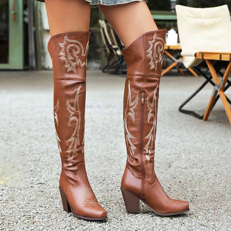 Stylish women's over the knee cowboy boots in brown with intricate stitching and a stacked heel