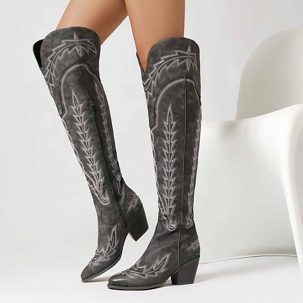 Stylish women's over the knee cowboy boots in gray with intricate stitching and a stacked heel
