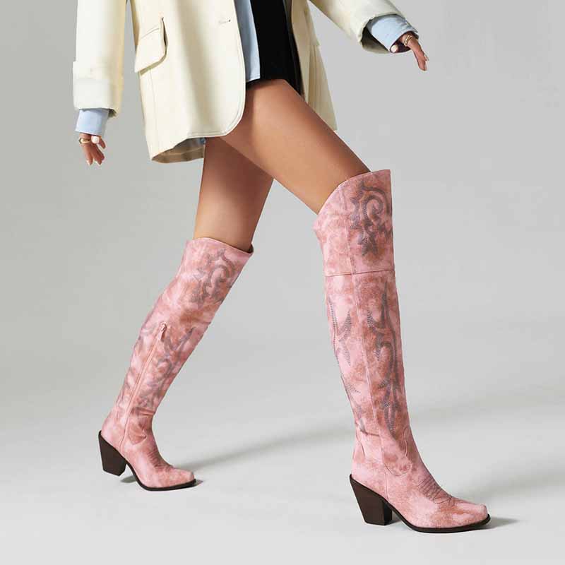 Stylish women's over the knee cowboy boots in blush pink with a sleek design and chunky heel