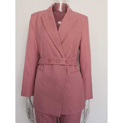 Stylish women's pink pantsuit for formal events featuring a belted blazer and tailored fit