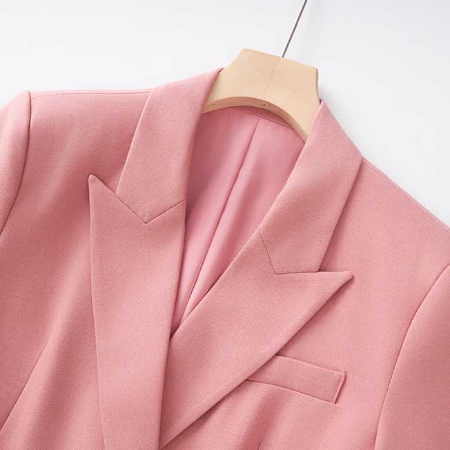Close-up of SD Dresscode women's pink pantsuit for formal events featuring a stylish blazer design