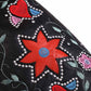 Close-up of women's retro floral cowboy boots featuring vibrant floral embroidery and decorative stitching