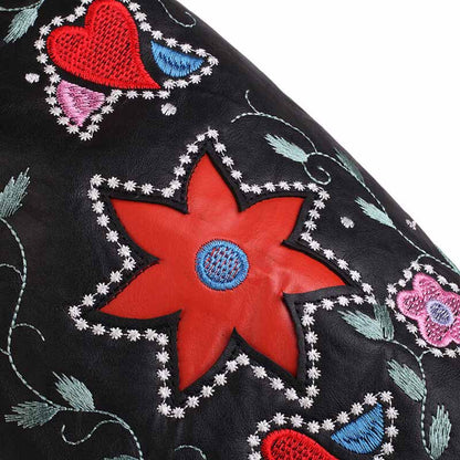 Close-up of women's retro floral cowboy boots featuring vibrant floral embroidery and decorative stitching