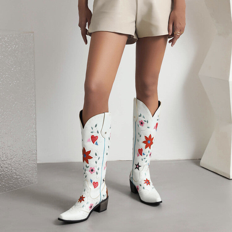 Stylish women's retro floral cowboy boots in white with colorful floral designs and a block heel