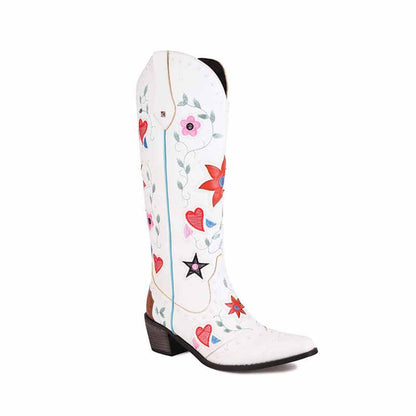 White women's retro floral cowboy boots featuring colorful floral and heart designs