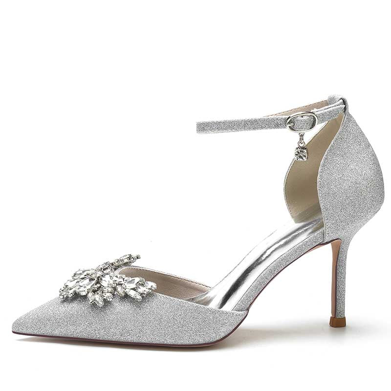 Stylish women's rhinestone wedding pumps with a pointed toe and ankle strap design in silver