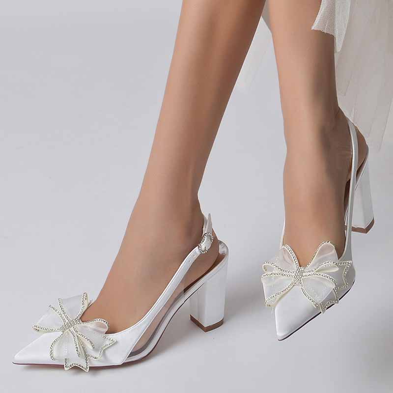 Stylish women's satin high heel sandals with decorative bows and shinny accents for elegant occasions