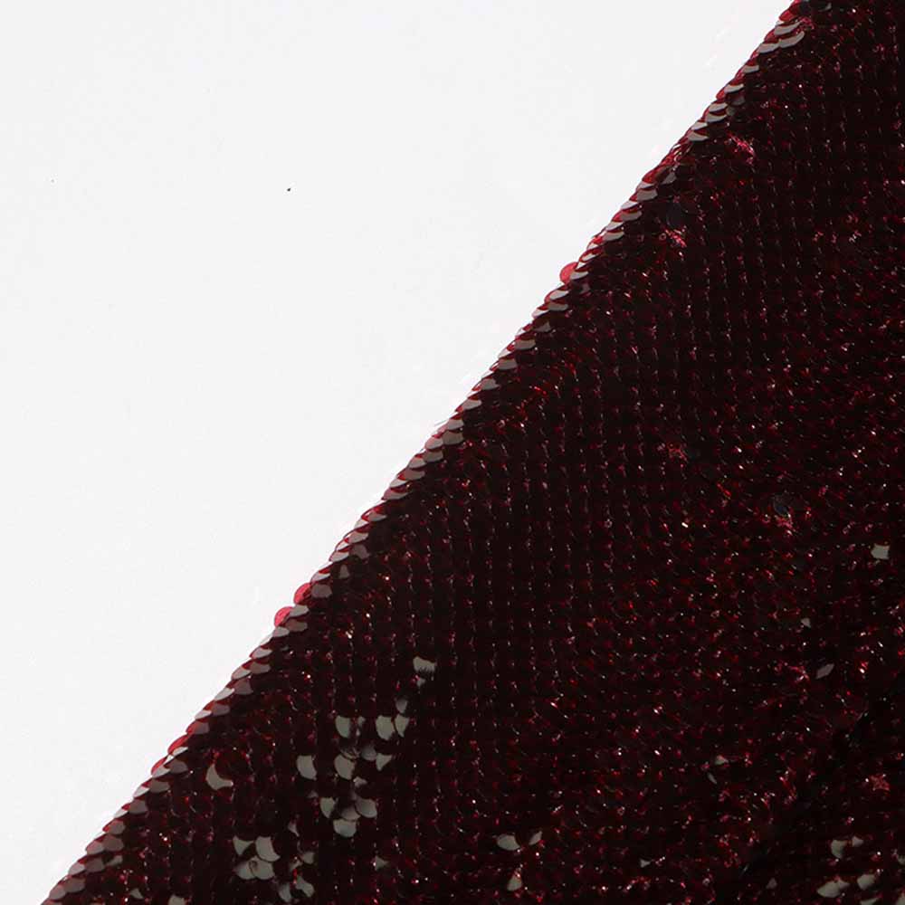 Close-up of a women's sequin blazer in a rich burgundy color, showcasing shimmering sequins.