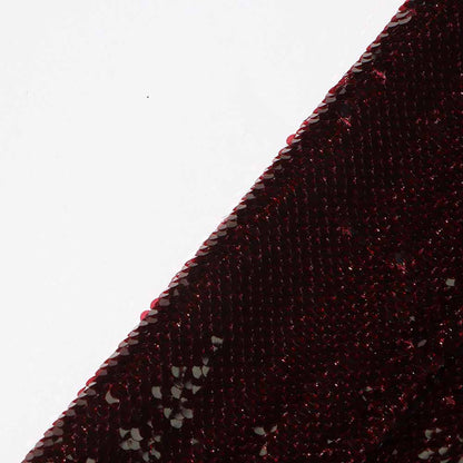 Close-up of a women's sequin blazer in a rich burgundy color, showcasing shimmering sequins.