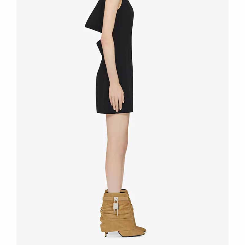 Side view of women's shark lock stiletto ankle boots in tan with stylish slouch design