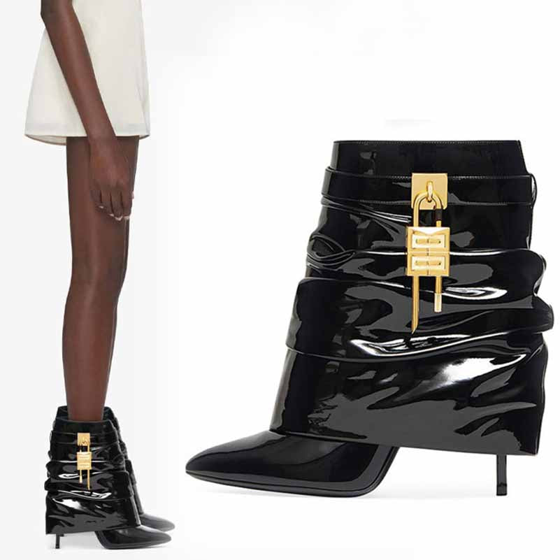 Stylish women's shark lock stiletto ankle boots in black with shiny finish and unique design