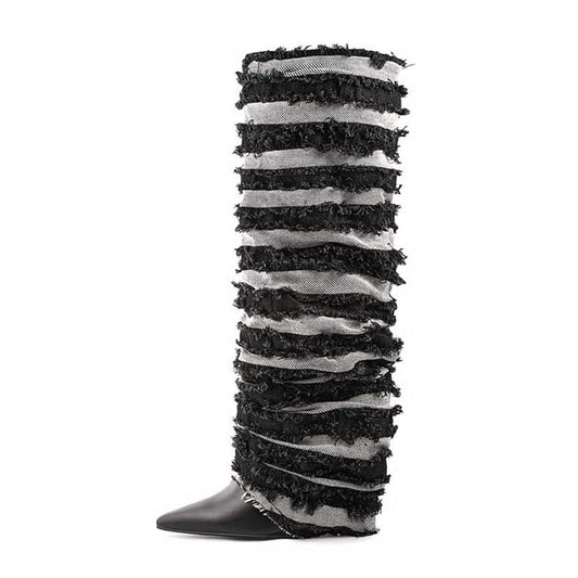 Stylish women's statement denim boots featuring layered fringe design and pointed toe for a bold look