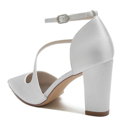 White women's strappy chunky heels with an ankle strap and pointed toe design