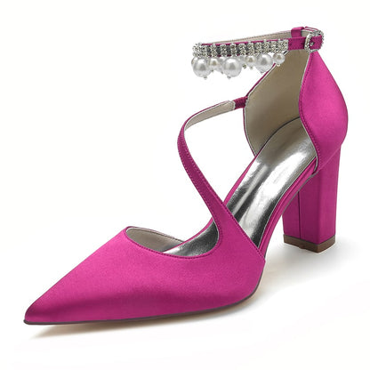 Women's strappy satin chunky heels in bright pink with decorative buckle and pearl details
