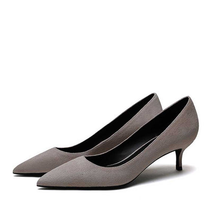 Elegant women's suede party heels in grey with a stylish pointed toe and comfortable kitten heel