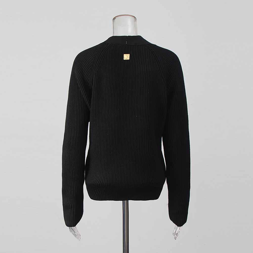 Women's v neck knitted cardigan in black with a stylish design and ribbed texture for cozy layering