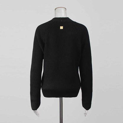 Women's v neck knitted cardigan in black with a stylish design and ribbed texture for cozy layering