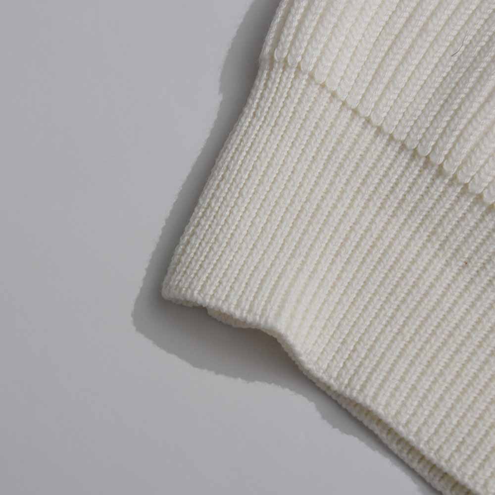 Women's v neck knitted cardigan in cream featuring a ribbed design and soft texture