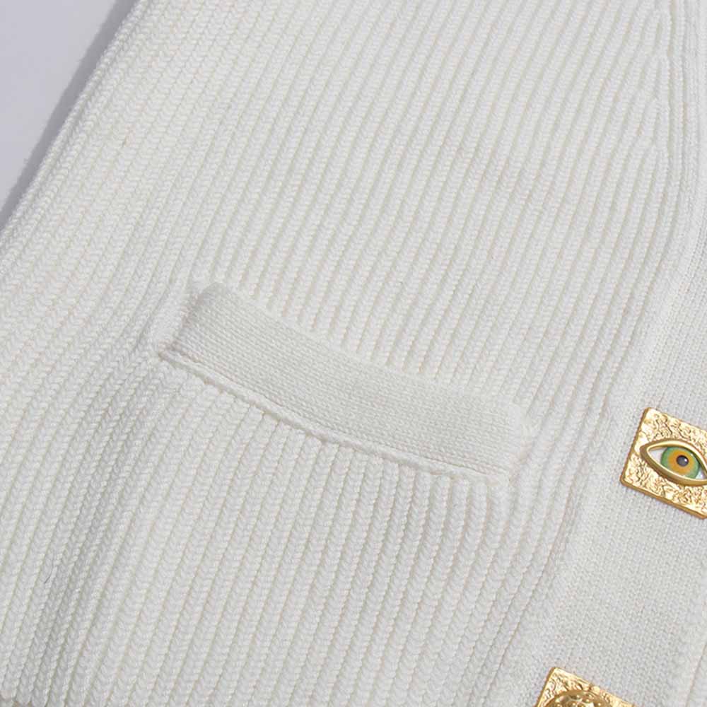 Women's v neck knitted cardigan in cream color with decorative buttons and pockets