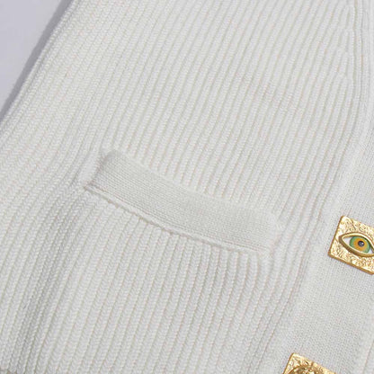 Women's v neck knitted cardigan in cream color with decorative buttons and pockets