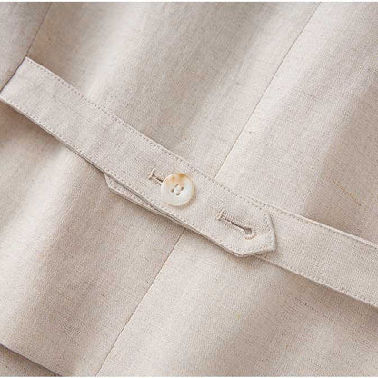 Close-up of the button detail on a women's vest pantsuit set in beige fabric by SD Dresscode & Fashiontrends