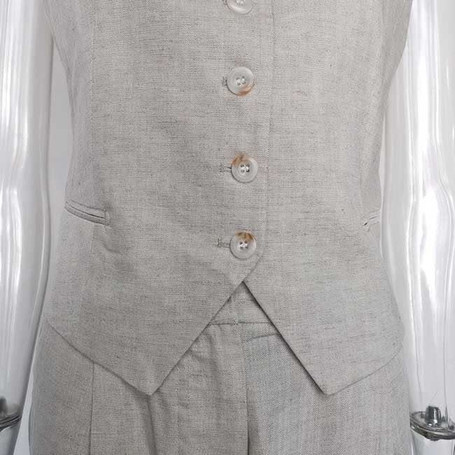 Light gray women's vest pantsuit set featuring a tailored vest with button closure
