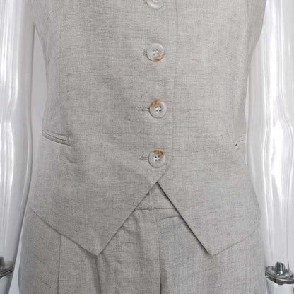 Light gray women's vest pantsuit set featuring a tailored vest with button closure