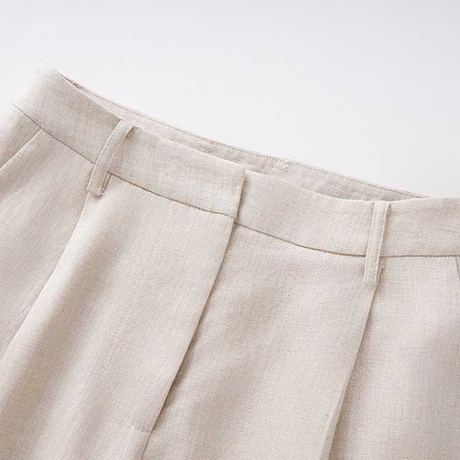 Women's vest pantsuit set in beige featuring tailored trousers for a stylish look