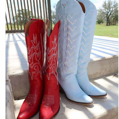 Stylish women's western embroidered boots in red and blue with intricate stitching details