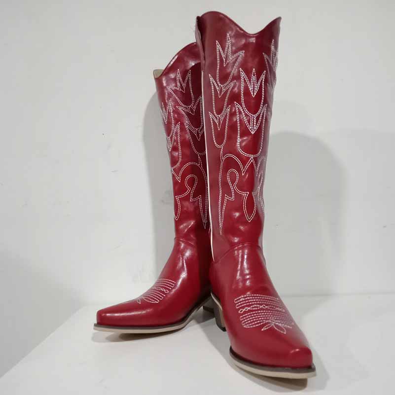 Red women's western embroidered boots with intricate white stitching for a stylish country look