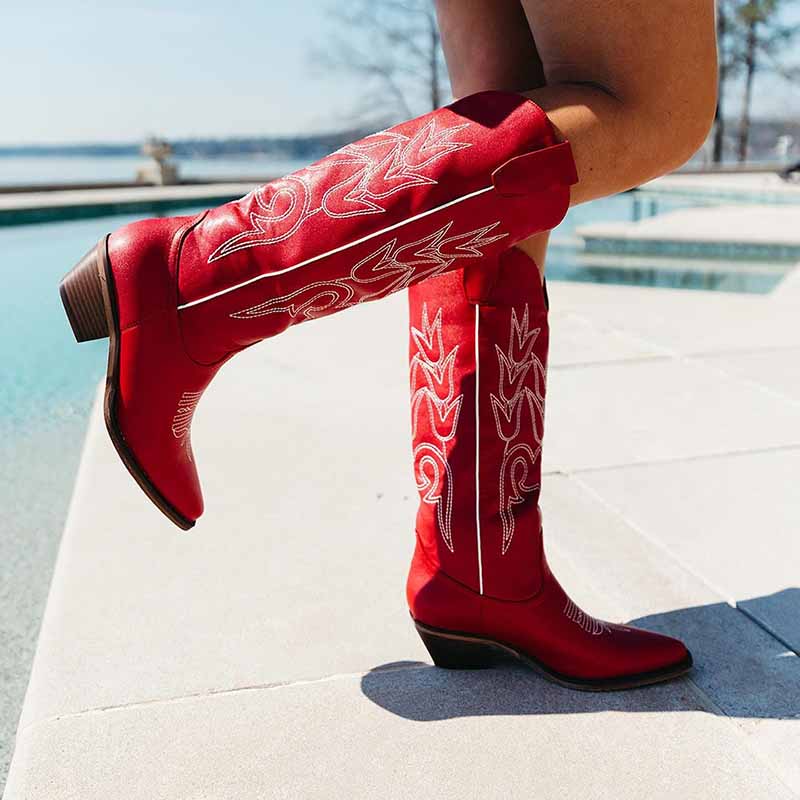 Stylish women's western embroidered boots in red with intricate white designs for a fashionable look