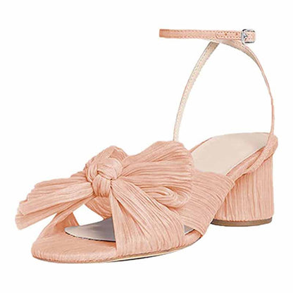 Elegant bridal bow knot heeled sandals in soft peach color with a stylish front bow design