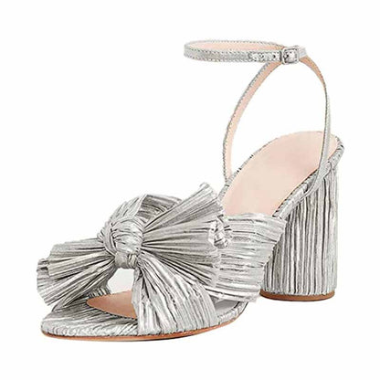 Silver bridal bow knot heeled sandals with a stylish block heel and ankle strap for elegant occasions