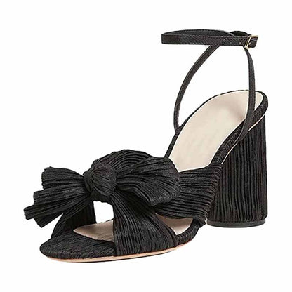 Elegant black bridal bow knot heeled sandals with a stylish pleated design and ankle strap