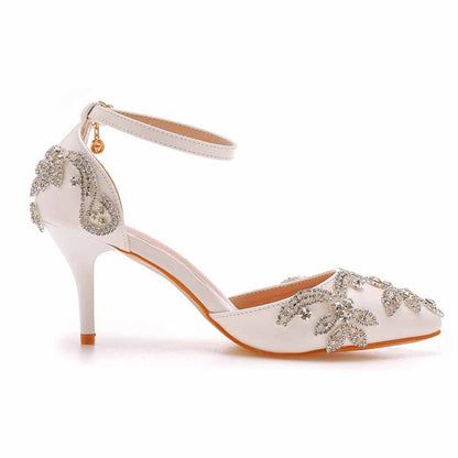 Elegant white bridal crystal heels for wedding with detailed embellishments and ankle strap