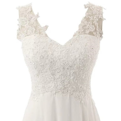 Elegant affordable simple wedding dress for bride with intricate lace detailing and V-neckline