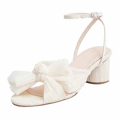 Elegant bridal bow knot heeled sandals in white with a stylish ankle strap and comfortable heel